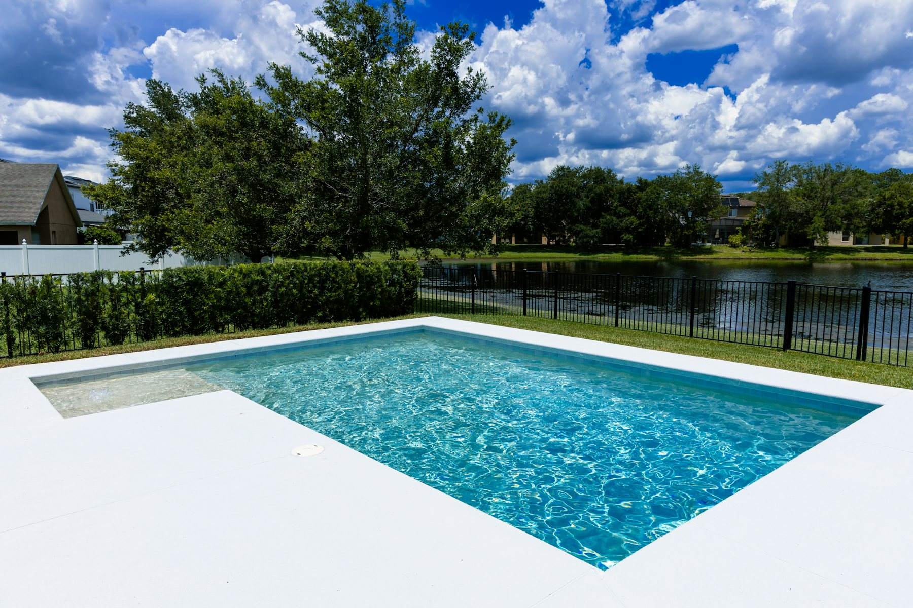 A private swimming pool beside a lake in Florida